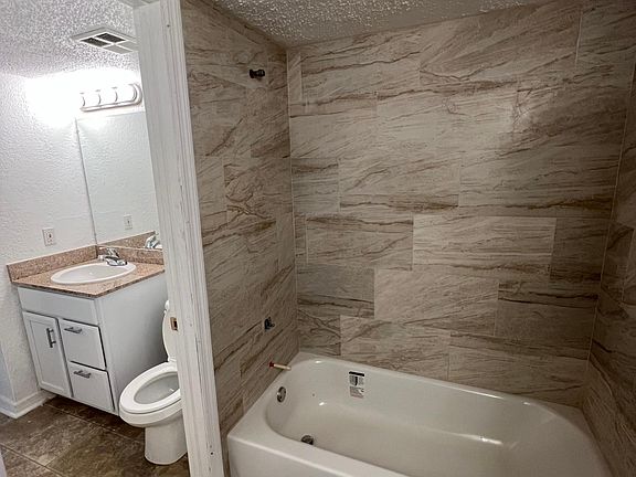 Full bathroom with access from suite and half bathroom