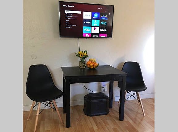 Smart TV with extendable dining table