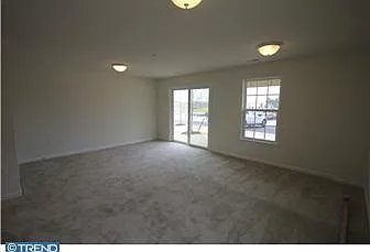 1st floor playroom/family room with sliding doors to backyard