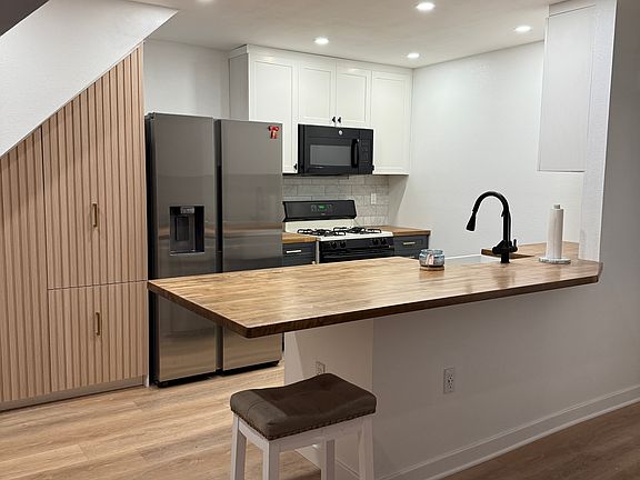 Chef's Dream Kitchen, Fully Renovated! Experience brand-new cabinetry and countertops. Bonus: Ample new storage and pantry features have been cleverly integrated for the ultimate organization.