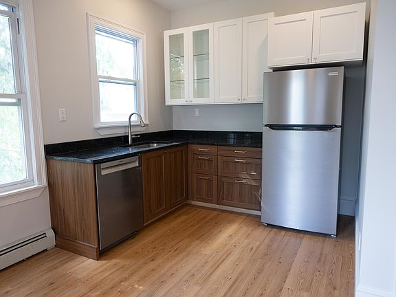 Kitchen with new granite countertops, and stainless dishwasher and fridge