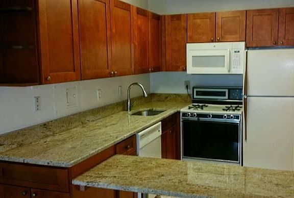 New granite countertops with beautiful matching cabinets