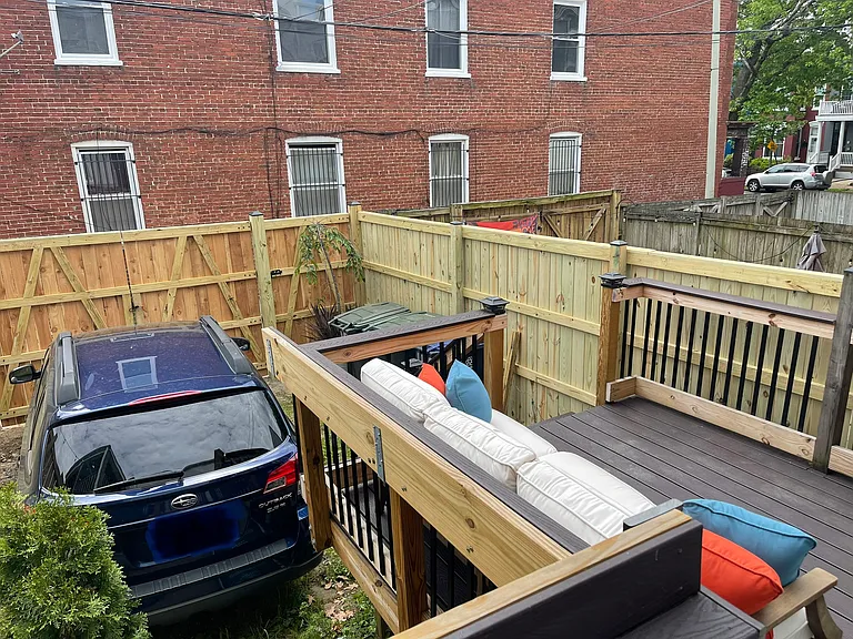 Rear deck with off-street gated parking space