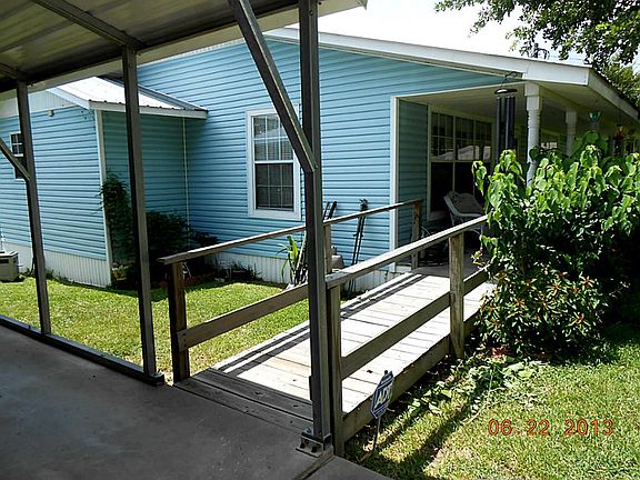 Handicap ramp to porch from carport.