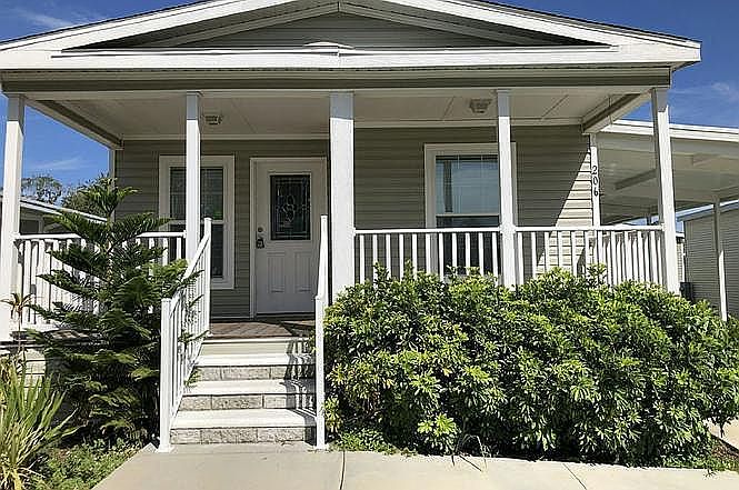 Front, Carport to the right.