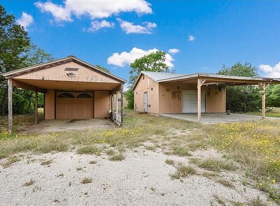 One was used as a garage and the other was used a shop.  Both on a slab and have electricity running to them.
