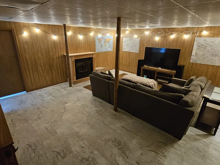 Finished basement shown furnished for layout example only. Rental is offered unfurnished.