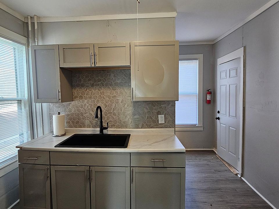 The kitchen has a Stove and Fridge.