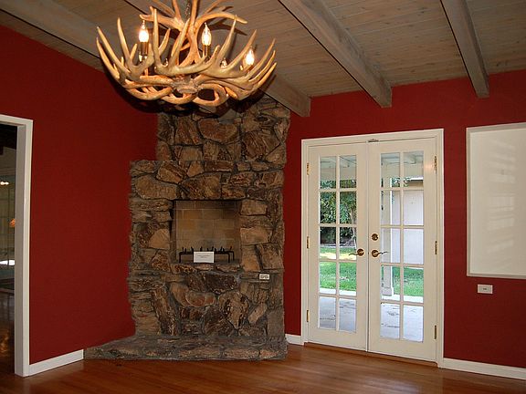 Fireplace in Dining Room - french doors lead to spacious patio