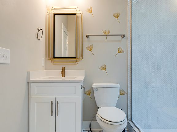 1st floor bath with large tiled shower.
