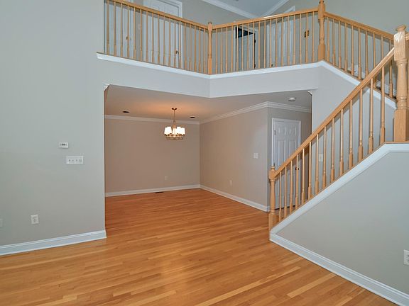 full view of dining + upper floor from living room