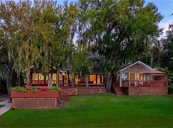 Beautiful waterfront home with large decks overlooking Lake Livingston.  Several large oak trees with spanish moss