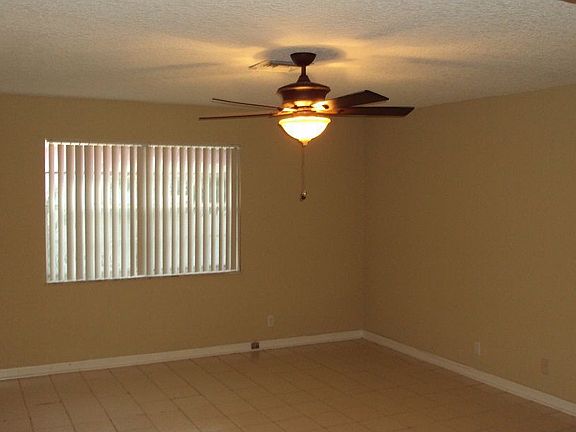Expansive Living Room with Upgraded Ceiling Fan 