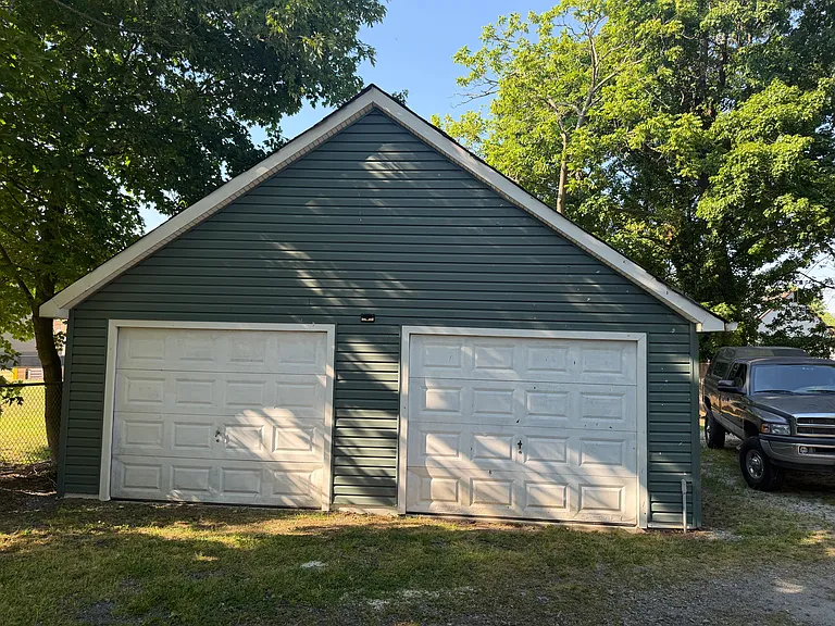 Large three car garage, third bay is in the back of the garage