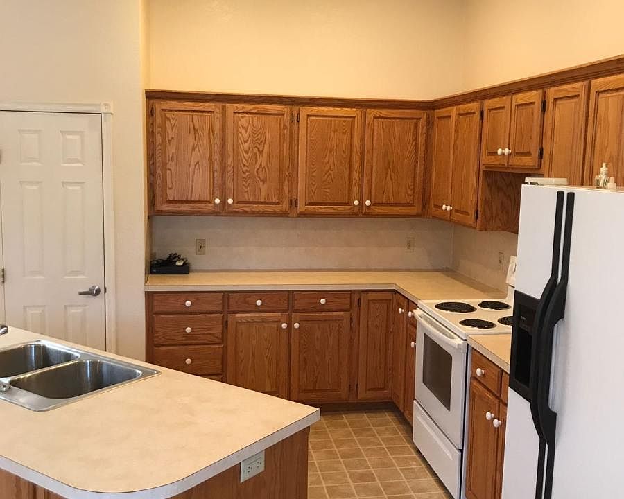Kitchen side view with door to pantry