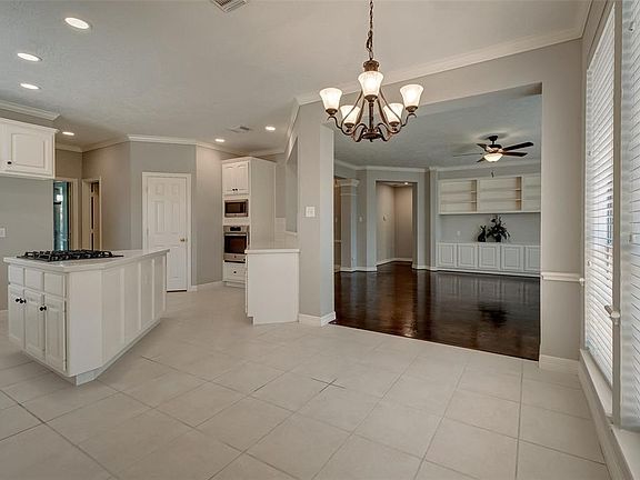 The breakfast room is the perfect spot to start your day in the natural light plus the recent lighting. Neutral tile flooring and a well-suited layout for everyone to enjoy.