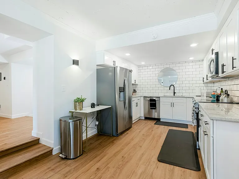 Brand new kitchen with stainless steel appliances (range, refrigerator, dishwasher and microwave)