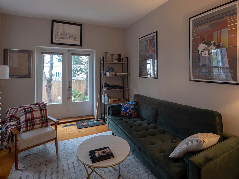 Living room with french doors opening out on to private garden
