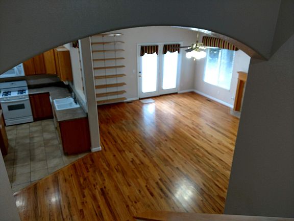 View of kitchen and living room from second level landing