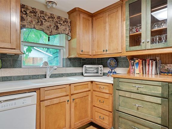 There is plenty of storage in the kitchen which is open to the breakfast room, den and dining room!