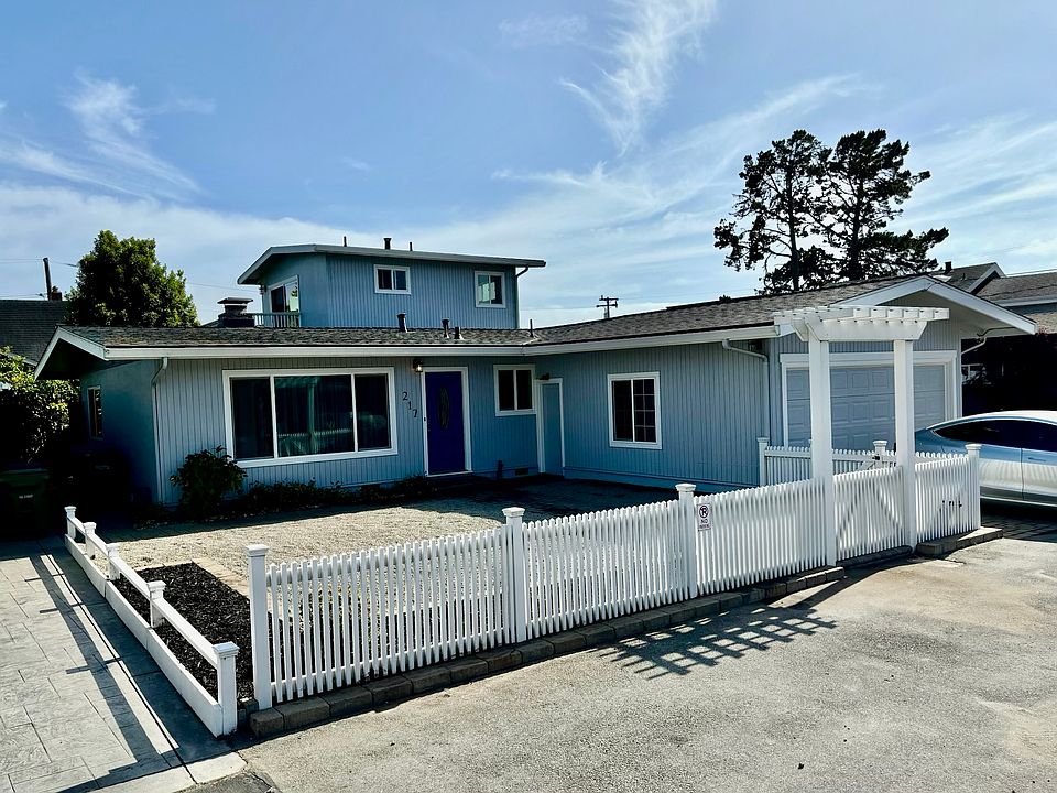 Landscaped front yard, 2 car garage and parking.