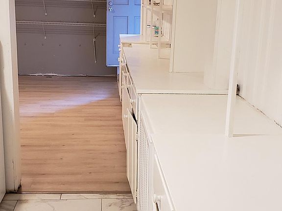 Looking from kitchen into main room. Note tons of storage on right wall.