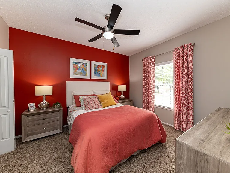 Cozy bedroom with carpet & ceiling fan