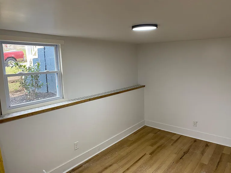 Large living room area with separate door to side yard