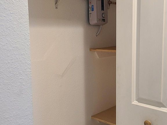 Storage closet next to laundry