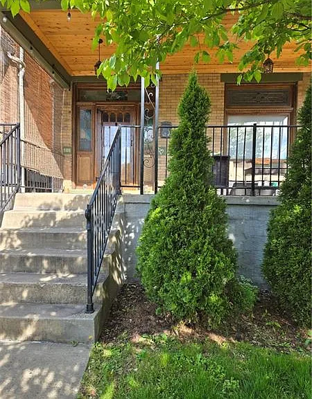 Front of the house: Spacious front porch over looking Lang Ave.