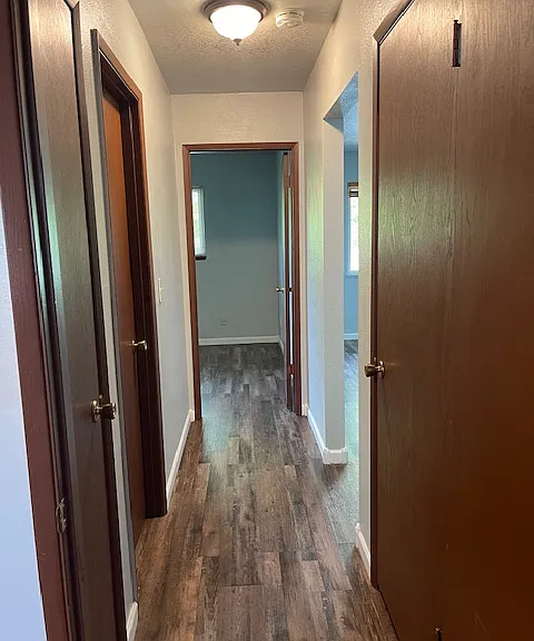 Hall between bedroom with two closets