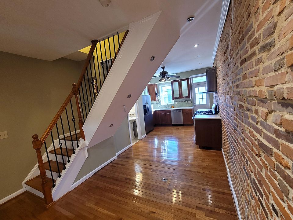 View from front room to kitchen and stairs