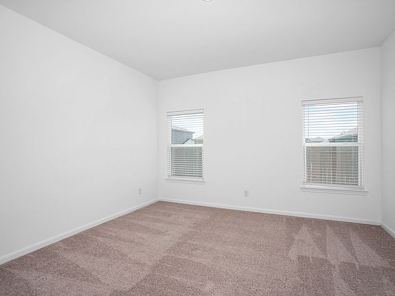 Master bedroom with double windows to allow a light and open space.