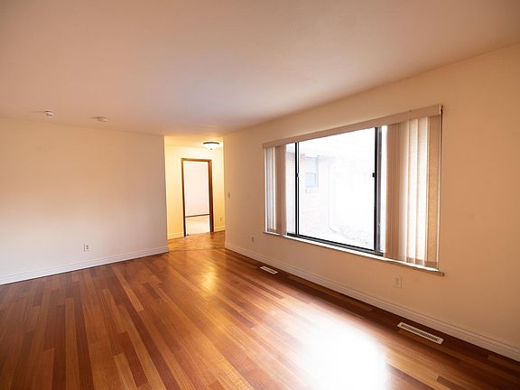 Cozy warm cherry hardwood floors in the living room