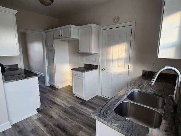 Kitchen with new refrigerator provided