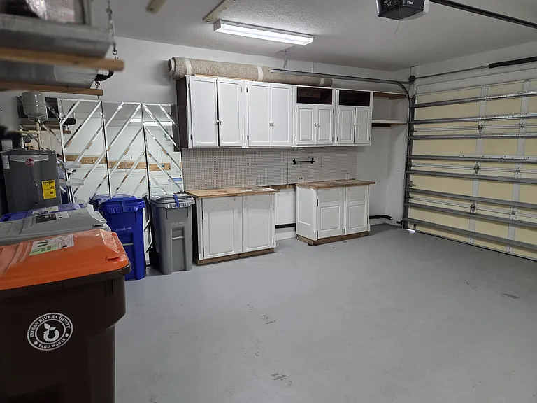 2 Car garage with storage cabinets