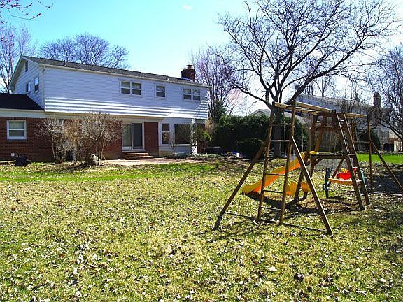 Large backyard with new beautiful stamped concrete patio