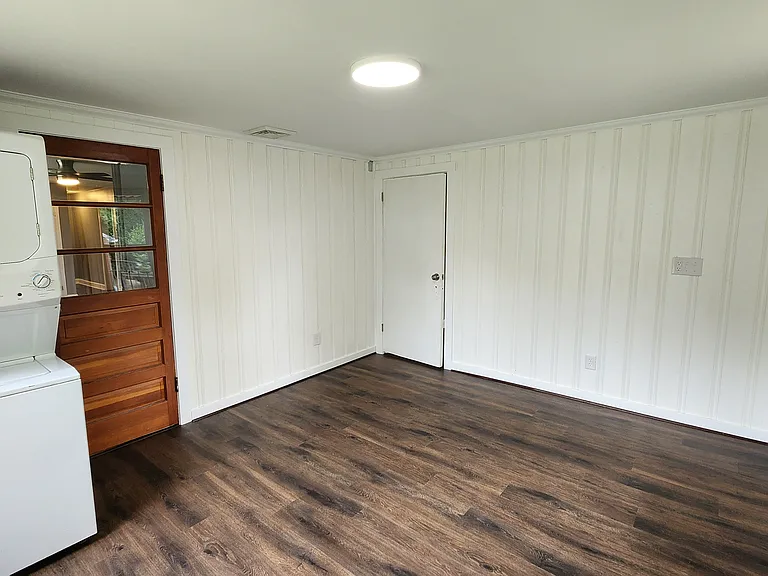bonus room/laundry looking at door to living room (left) and bedroom (center/right)