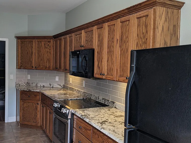 Granite counter tops (*black refrigerator not included)