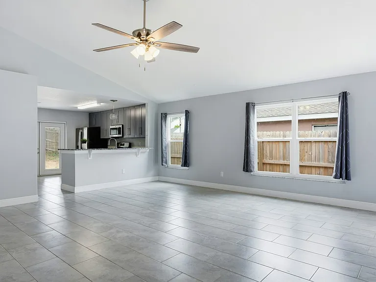 Kitchen with all stainless steel appliances, gas range, soft close cabinets & granite counter tops