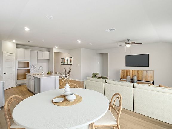 Virtually staged dining room in the Preston floorplan at a Meritage Homes community.