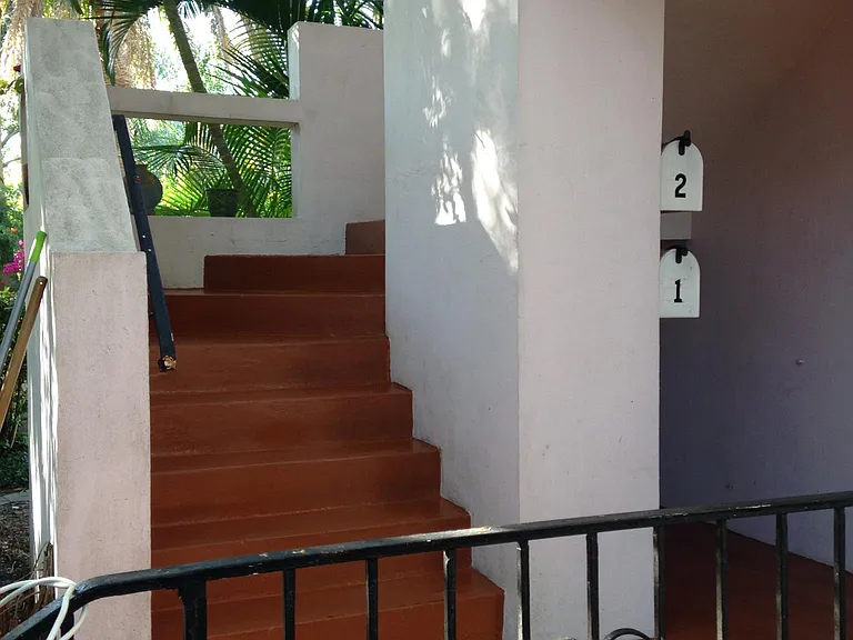 Front steps leading to the upstairs apartment