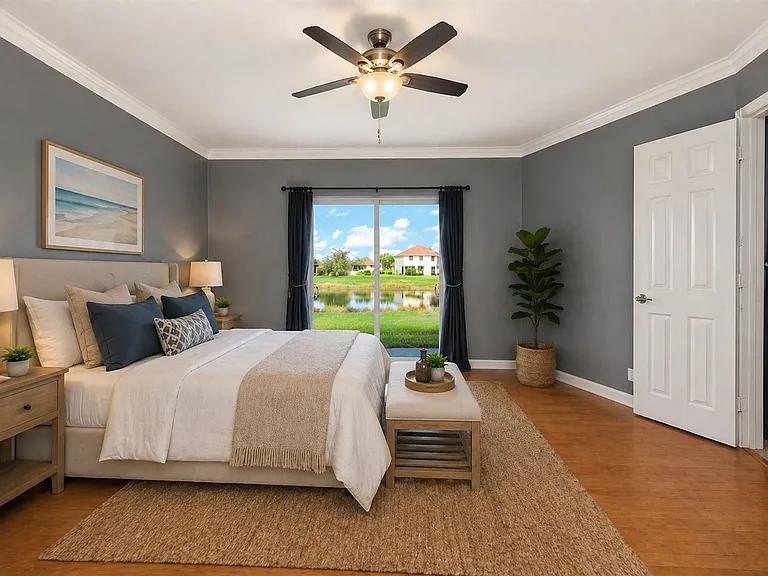 Primary bedroom overlooking pond