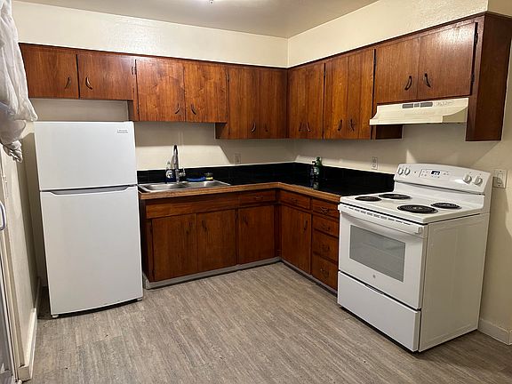 Kitchen with new fridge and new stove