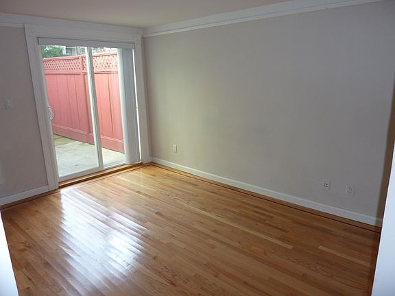 Back bedroom with sliding door to outside, private patio.