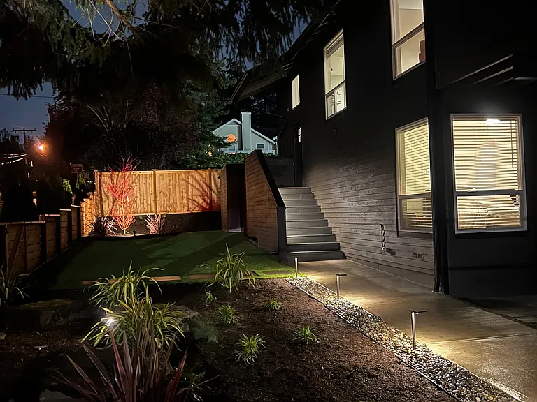 Private Entrance with lighted walkway and artificial turf for year round beauty
