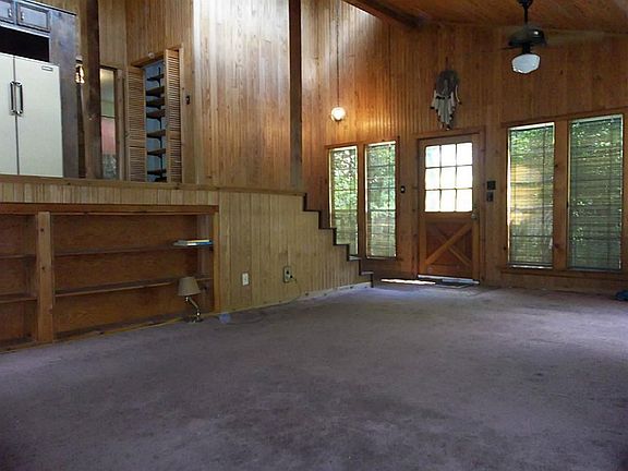 Another view of the den looking towards back door and kitchen, up