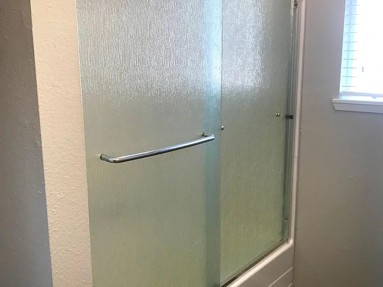 Tub/shower with glass door enclosure