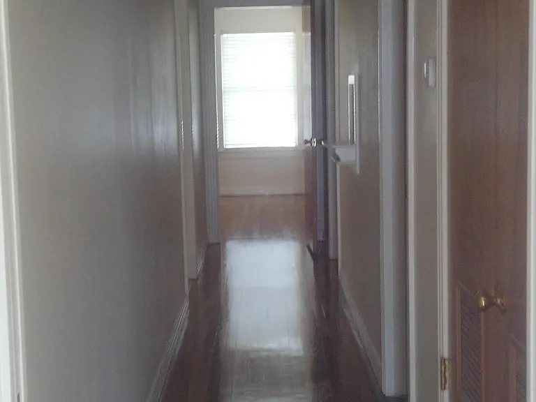 Hallway to bath and 2 bedrooms.