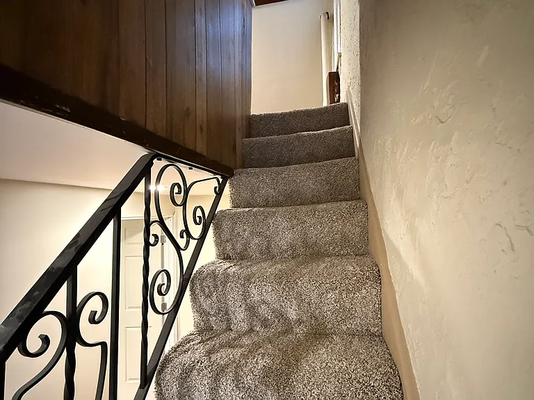 Stairs to 3rd floor, 2nd bedroom. Queen bed.